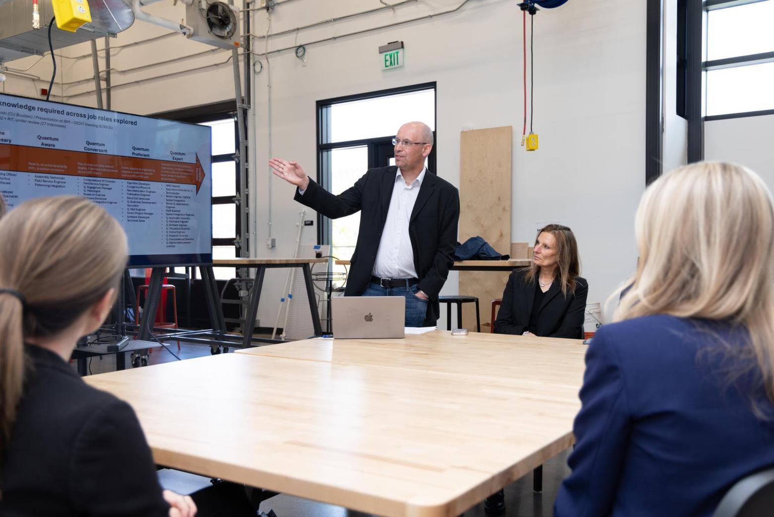 Fred Sarazin, the newest Ben L. Fryrear Presidential Chair, discusses the different levels of quantum knowledge required by industry today during a recent campus visit by U.S. Rep. Brittany Pettersen.